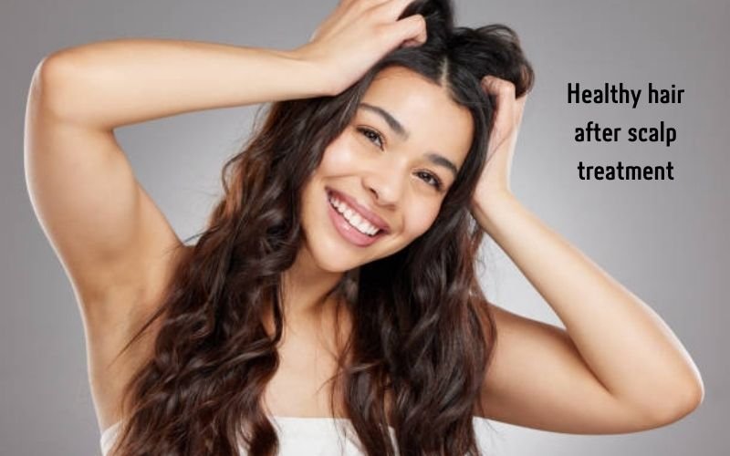Smiling woman with healthy hair after treating itchy scalp and hair loss.