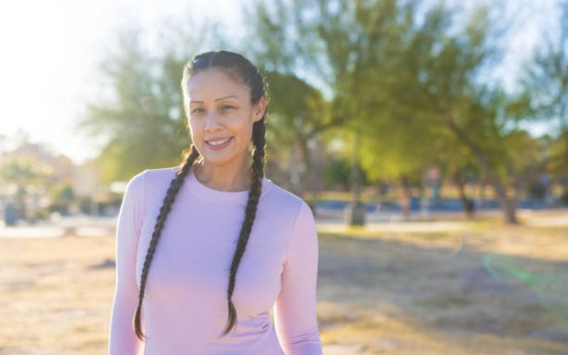 Braided ponytail hairstyle on black hair with cornrows.