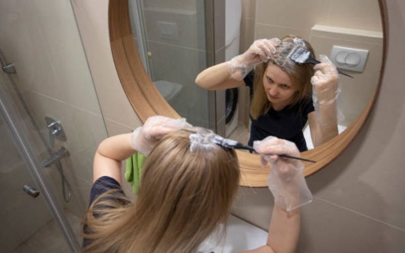 Applying platinum blonde hair dye