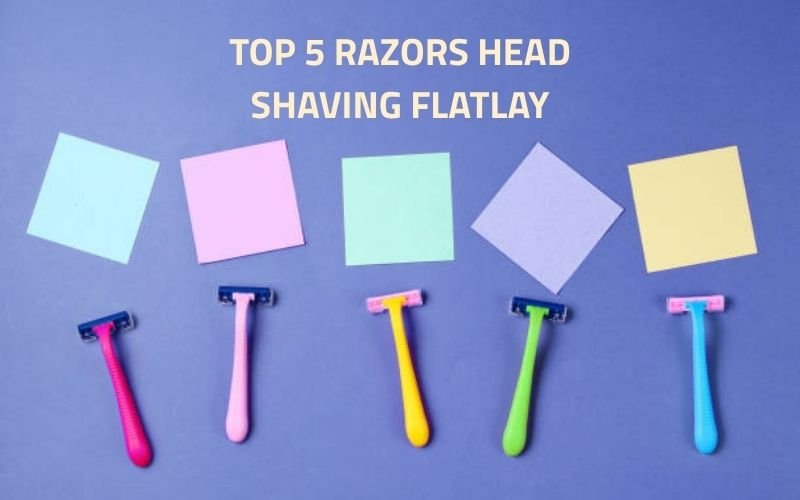 Top 5 razors for shaving the head, displayed on a wooden countertop.