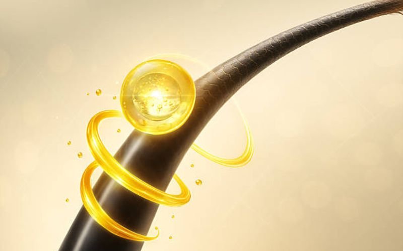 Close-up of melanin-rich hair texture showing curls and coils