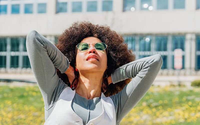 Confident woman with long healthy melanin-rich natural hair