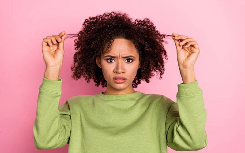 Common natural hair care mistakes leading to dryness and split ends.