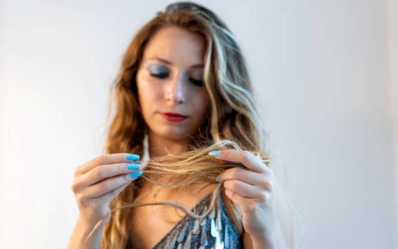 damaged hair with split ends and dryness.