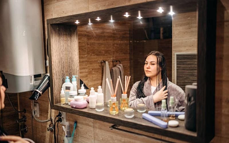 flat lay of AM and PM hair care products arranged as schedule