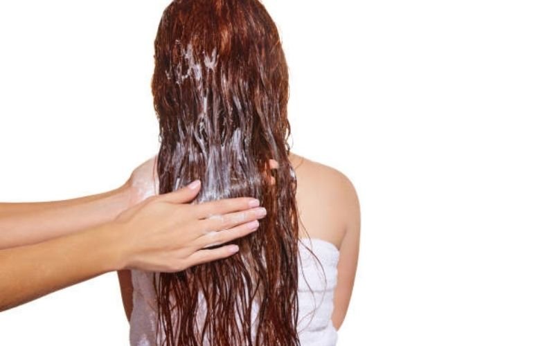 homemade hair mask applied on long hair