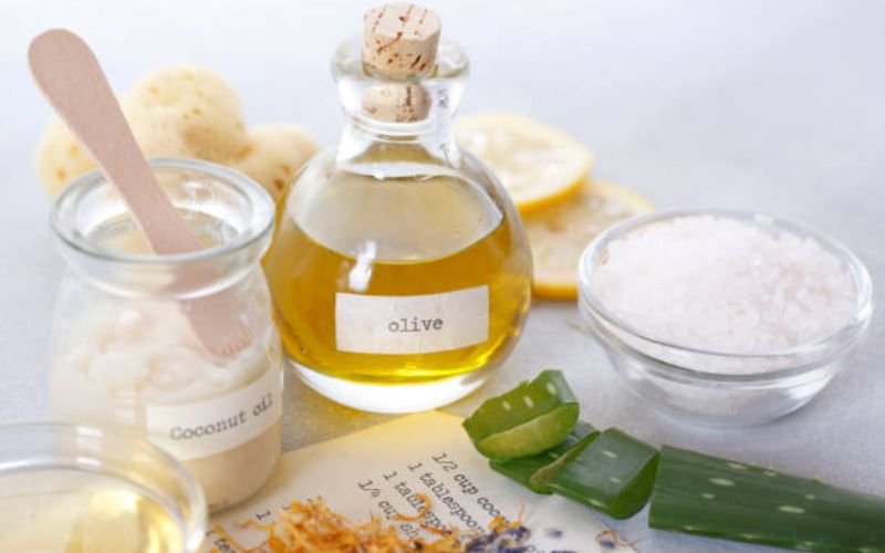 close-up of aloe vera, jojoba oil, and chamomile flowers