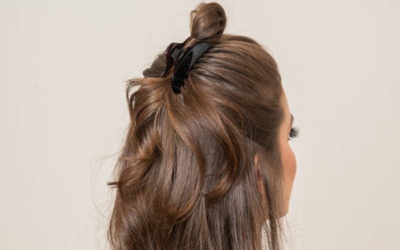 messy claw clip bun hairstyle casual easy look