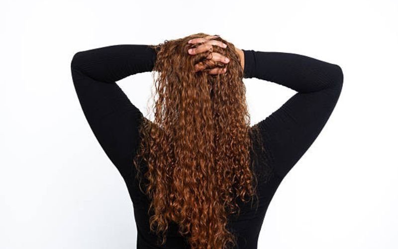 scrunch curly hair to enhance curl pattern